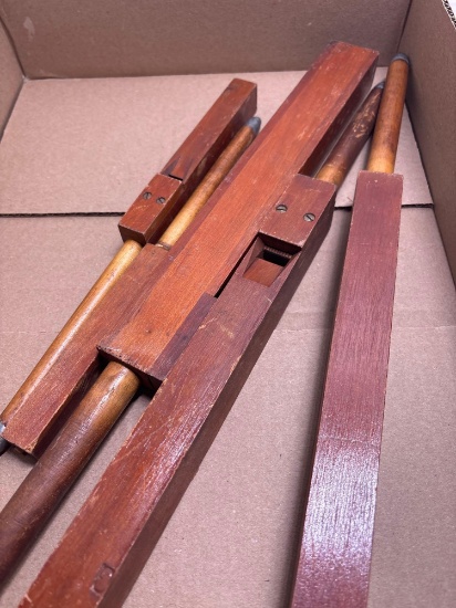 Five wooden pipe organ pipes