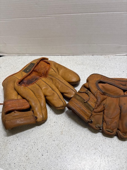 Two antique baseball gloves