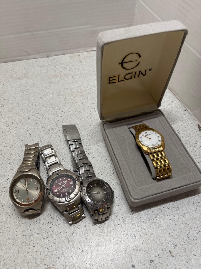 Four mens wrist watches