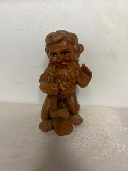carved wooden troll or gnome with axe
