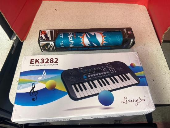 Lexington, electric keyboard, and dolphins desk pad
