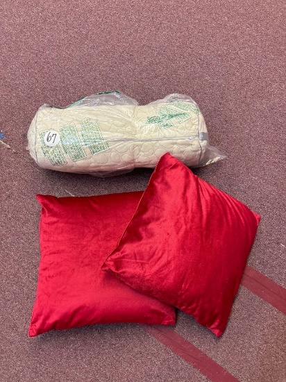Neck roll pillow and two other pillows