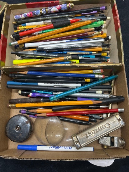 pens, pencils and harmonica, etc.