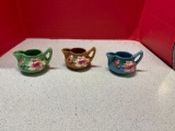 Three Roseville pottery creamers