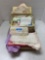 Sewing basket with items inside, fabric, lace, trim, etc.
