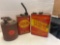 three vintage metal gas cans