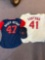 2 Cleveland Indians jerseys and a hat