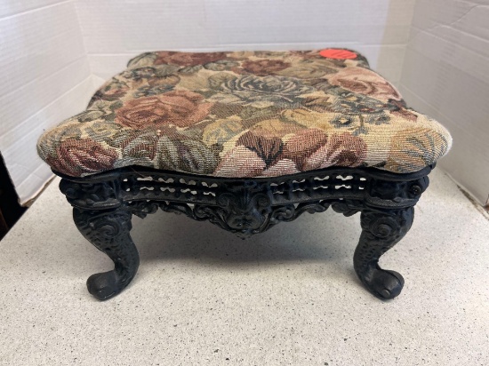 vintage cast iron footstool with tapestry
