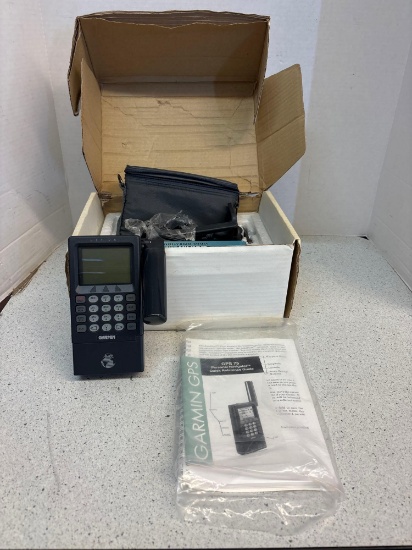 Vintage Garmin navigator in original box with papers