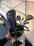 ping golf bag with ping eye 2 clubs, Nike driver and 4 vintage putters