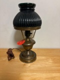 Small brass hurricane lamp with green glass shade