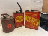 three vintage metal gas cans