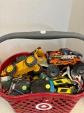 Plastic tote full of toy vehicles