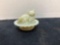 miniature custard glass cat on nest glows