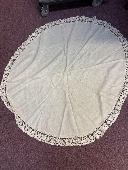 Round linen tablecloth with crocheted edge