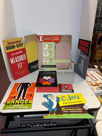 Cardboard shoe advertising out of old department store in downtown Barberton
