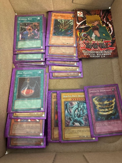 44 YU-GI-OH! Cards with amethyst backs, and rule book