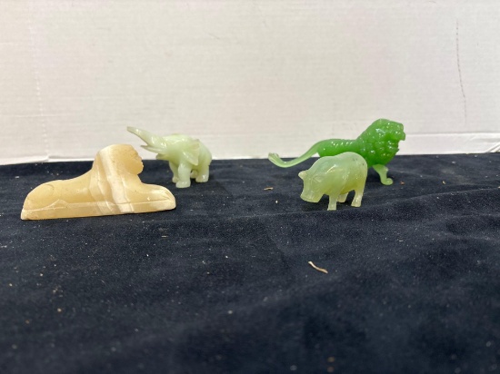 Miniature stone animals sphinx