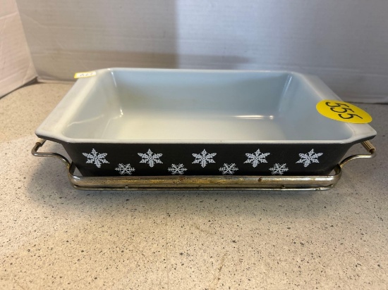 vintage Pyrex black and snowflake rectangular dish on metal stand