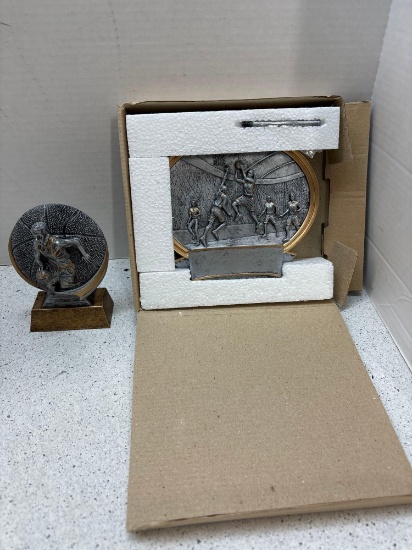 Box of unengraved basketball trophies