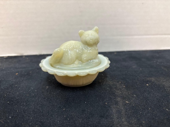 miniature custard glass cat on nest glows