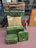 Five pieces of vintage luggage