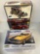 two Dodge Challenger and one Ford Victoria, car models in open boxes