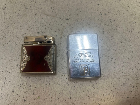zippo cigarette lighter with advertising and ornate Lunder 1000 lighter with engraving