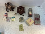 2 lighters, SYROCO cuckoo clock, cat salt and pepper, Kennedy flasher badge, shaving brush, etc.