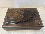 Russian box with embossed man and celestial flying horse on lid