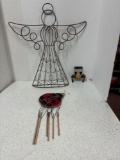 Angel yard art and wind chimes