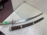 short sword, etched blade, metal guard and handle