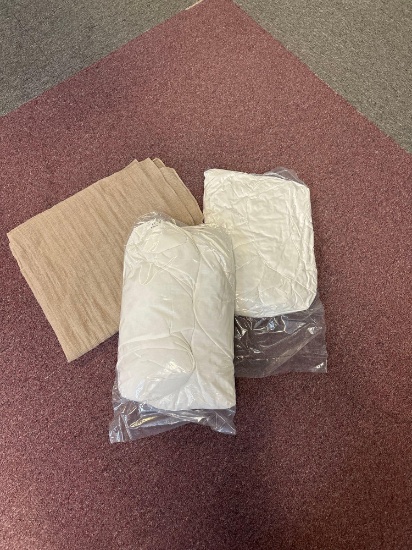 Two pillows and a lightweight throw