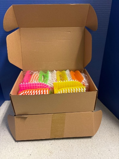 Two boxes of colorful, scrub brushes