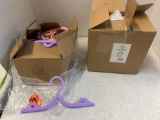 box of folding hangers and crab toilet paper holder