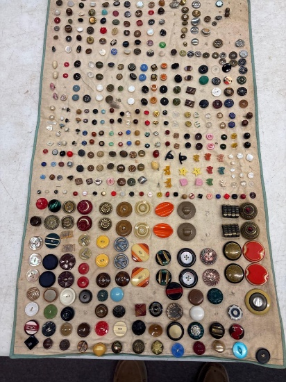 Antique button collection sewn on cloth