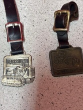 2 Caterpillar, heavy equipment, watch fobs