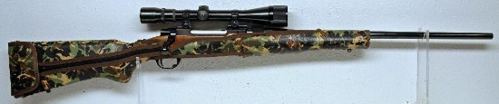 Ruger M77 .257 Roberts Bolt Action Rifle w/Weaver V9-2 Scope Padded Camo Wrap that is secured with