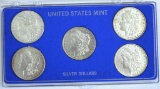 (5) Morgan Dollars in Plastic Case 1879, 1880, 1881, 1882, 1883