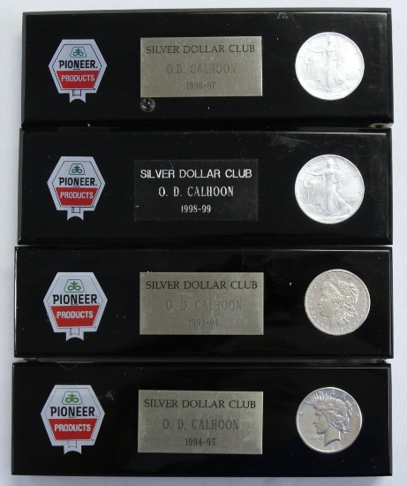 (4) Pioneer Seeds Sales Award Paperweights w/ (2) 1995 Silver Eagles, 1921 Morgan Dollar, 1926 Peace