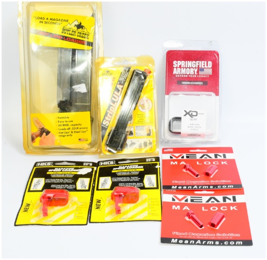 A Group of Six Firearm Accessories, including a Maglula M-16/AR-15 StripLULA Loader and a Butler Cre