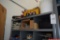 Contents on shelf including caulk, blades, nails, bulbs, etc