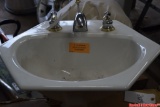 Porcelain Sink with DELTA Faucet