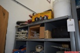 Contents on shelf including caulk, blades, nails, bulbs, etc