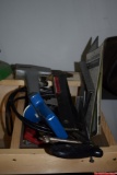 Lot of various tools including nailer, hacksaw, etc