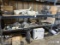 Truck parts on pallet rack including washer fluid containers, hose , air bags , shocks , hangers , f
