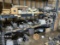 Truck parts on pallet rack including alternators , AC compressors , electrical, lights , brake parts