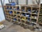 Truck parts cubby hole cabinet including assorted parts, lights, nuts, bolts, valves