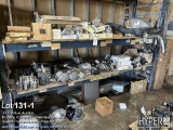Truck parts on pallet rack including alternators , AC compressors , electrical, lights , brake parts