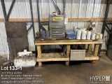 Truck parts bench with oil filters , parts storage box , propane tank